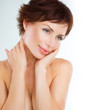 Beautiful Young Woman touching her Face. Skincare. Perfect Skin