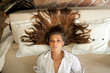 Young beautifull lady with long hair on romantic bed Young beautifull lady with long hair on romantic bed