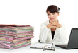 young business woman with laptop and many paper
