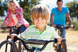 Young family on country bike ride