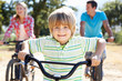 Young family on country bike ride