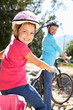 Little girl on country bike ride with grandma