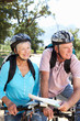 Senior couple with map on country bike ride