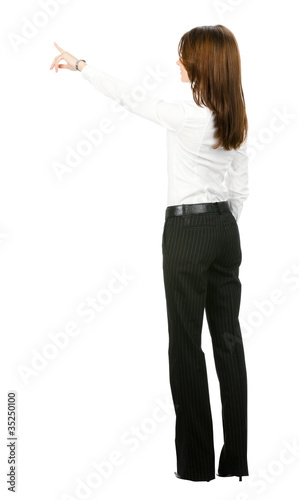 Photo: Full body of business woman pointing at something Full body of business woman pointing at something