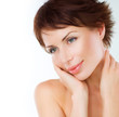 Beautiful Young Woman touching her Face. Skincare. Perfect Skin