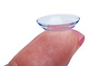 Woman holds a Contact Lens