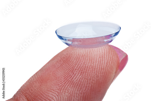 Photo: Woman holds a Contact Lens Woman holds a Contact Lens