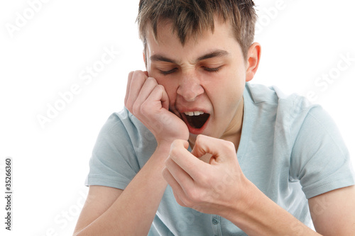 Photo: Yawning tired or bored boy Yawning tired or bored boy