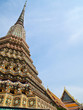 Ancient pagoda with Wat Pho on the background Ancient pagoda with Wat Pho on the background