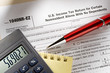Tax form and pen