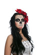 Photo: Serious woman in day of the dead mask isolated Serious woman in day of the dead mask isolated
