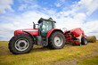 tractor collecting haystack in the field