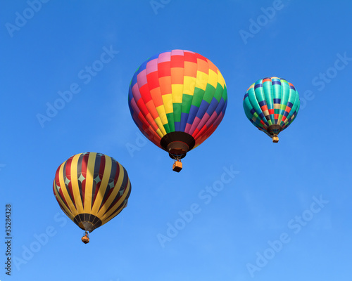 Photo: hot air balloons over blue sky hot air balloons over blue sky