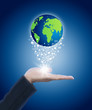 Hand holding globe with massage icon