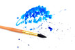 brush with blue paint stroke and stick