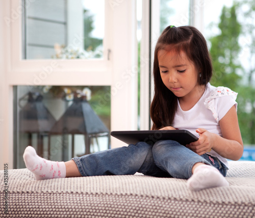 Photo: Child Using Digital Tablet Child Using Digital Tablet