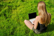 Foto: girl with laptop sitting girl with laptop sitting