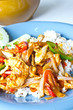 Stir fry chicken and chili in oil
