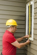 Foto: carpenter measuring window repair carpenter measuring window repair