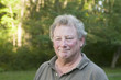 middle age senior man in suburban backyard