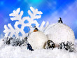Christmas still life with snowflake in snow and ball.