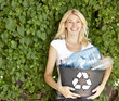 Young woman with recycling box. Copy space