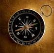 Vintage compass isolated on old paper background Vintage compass isolated on old paper background