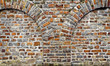 Cut out rocks in wall with arched brickwork