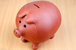 Piggy-bank on a wooden table