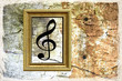 Photo: Texture - muro vecchio, cornice e chiave di violino Texture - muro vecchio, cornice e chiave di violino