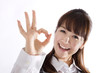 Beautiful business woman showing okay sign