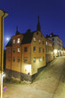 Night with full moon over old houses in Stockholm