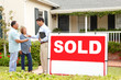Senior Hispanic couple buying new home