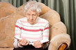 The elderly woman reads the book
