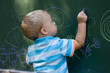 Photo: Boy drawing with chalk Boy drawing with chalk