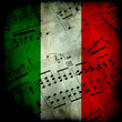 Spartito musicale su bandiera italiana