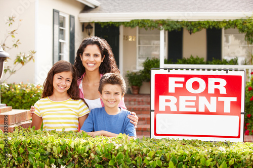 Photo: Mother and children outside home for rent Mother and children outside home for rent
