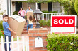 Photo: Family moving into new home Family moving into new home