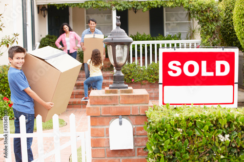 Photo: Family moving into new home Family moving into new home