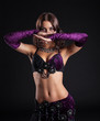 Attractive brunette girl posing in arabic dance