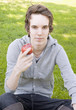 Young man holding an apple Young man holding an apple