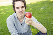 Young man holding an apple Young man holding an apple