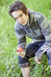 Young man holding an apple Young man holding an apple