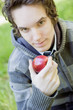 Young man holding an apple Young man holding an apple