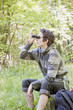 Photo: Young man birdwatching Young man birdwatching