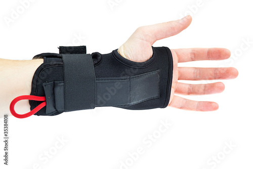 Photo: Wrist support with hand isolated on white. Wrist support with hand isolated on white.