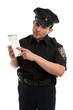 Photo: Police officer or traffic warden with infringement ticket Police officer or traffic warden with infringement ticket