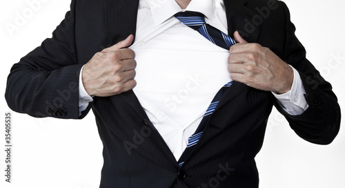 Photo: Superhero businessman opening shirt Superhero businessman opening shirt