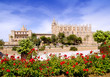 Majorca Cathedral and Almudaina from red flowers garden Majorca Cathedral and Almudaina from red flowers garden