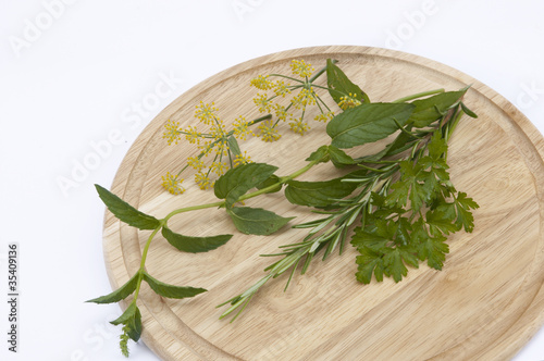 Photo: Herbs on a cutting board Herbs on a cutting board